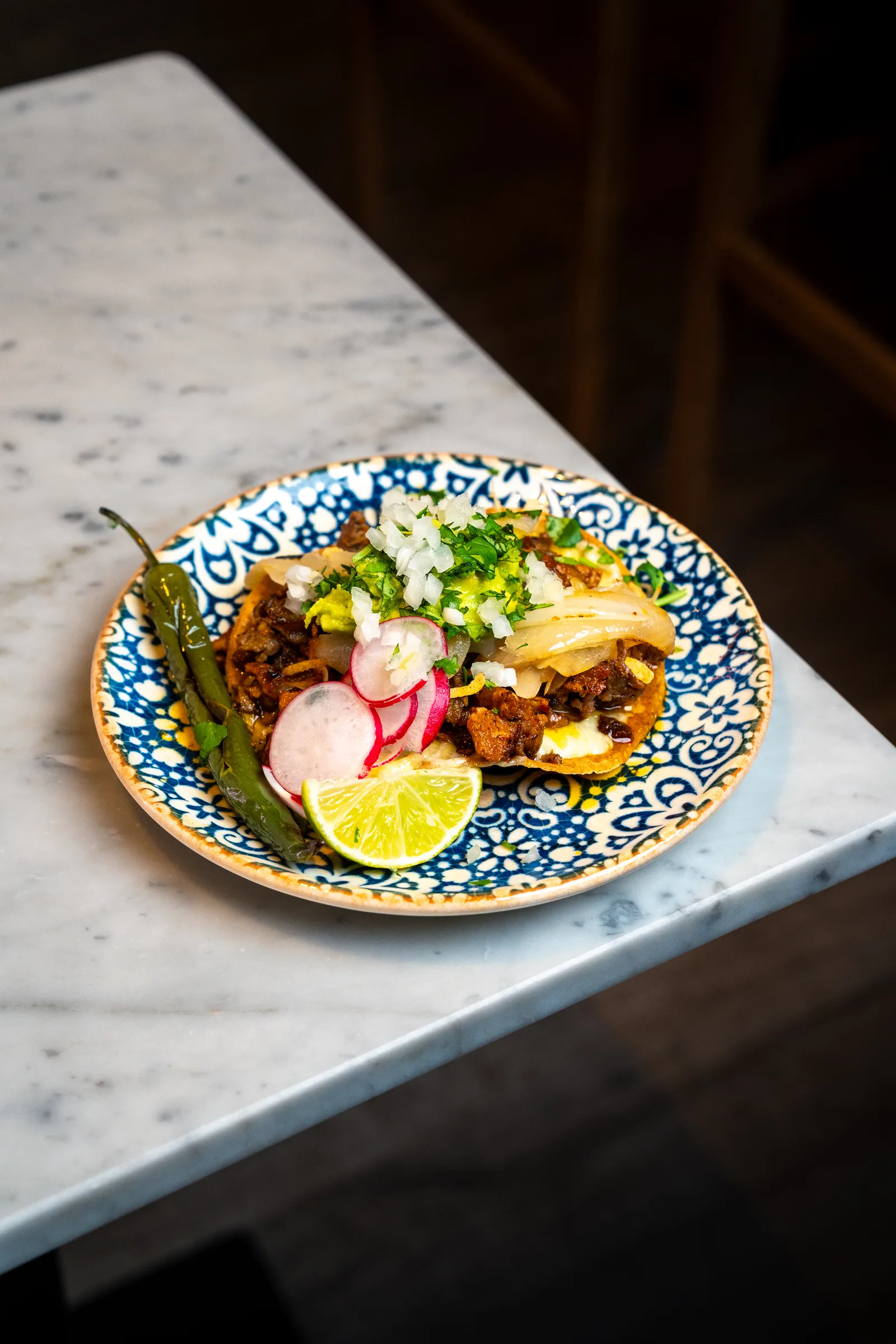 Tacos on blue ceramic plate
